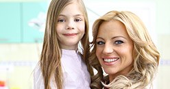 Smiling mother and young daughter