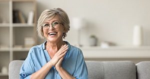Happy, smiling senior woman in her living room