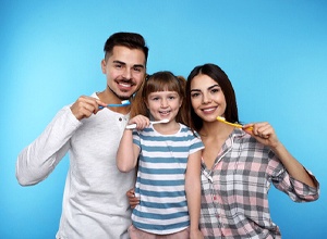 family with toothbrushes
