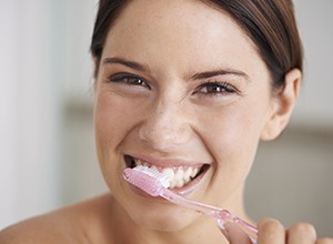 Woman brushing teeth