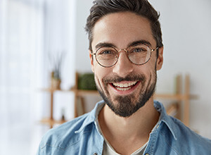 Young man with dental implants in Meriden