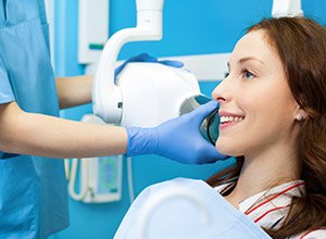 Woman receiving digital dental x-rays