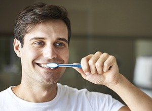 Man brushing teeth