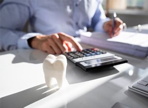 Using calculator to budget for the cost of root canal therapy