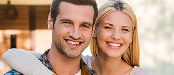 family of four smiling