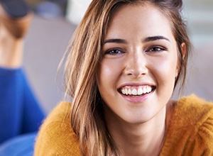 Patient placing Invisalign tray