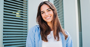 Smiling young woman, showing perfect teeth