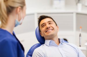 Happy patient at appointment for a root canal in Meriden